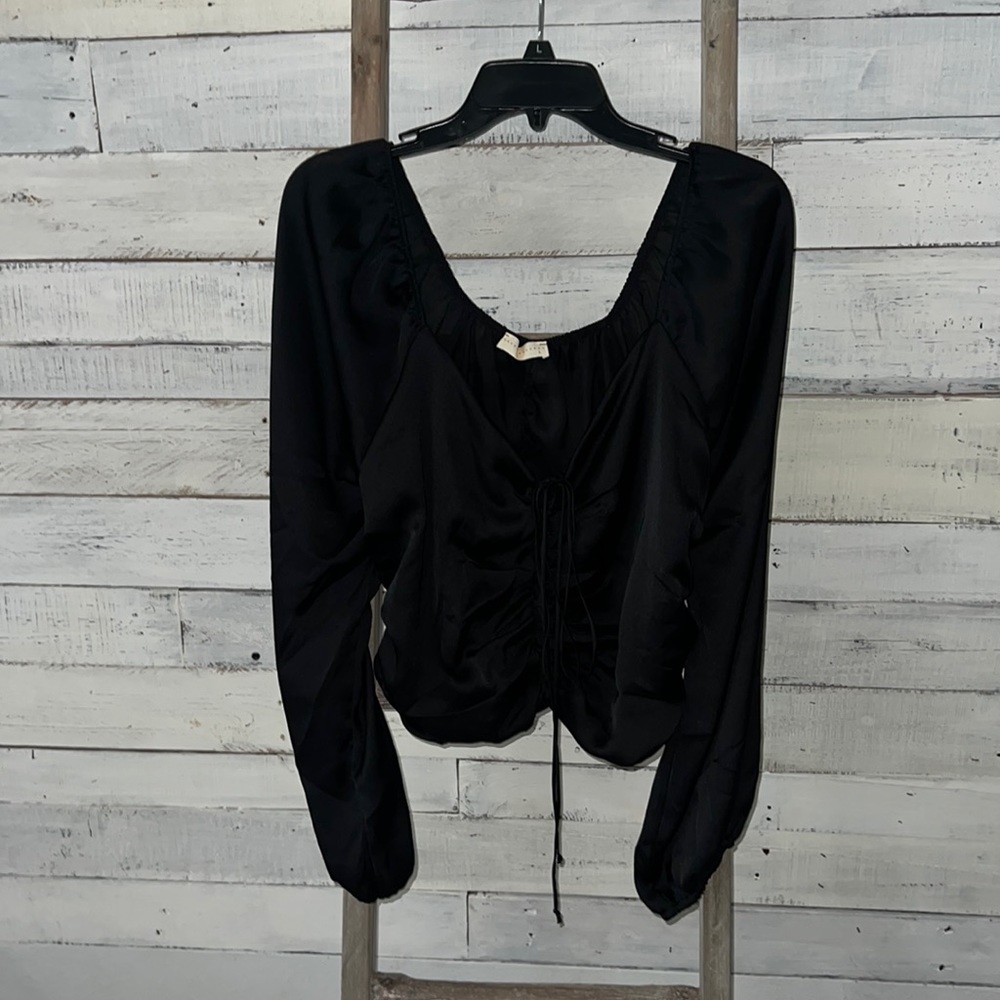 Satin crop top with crisscross tie down the front of the shirt! So cute!